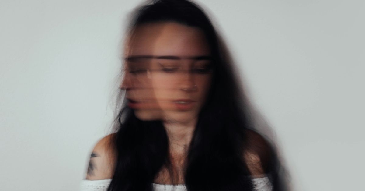 Blurred photo of a woman battling anxiety/depression; prayers for young adults living with disabilities